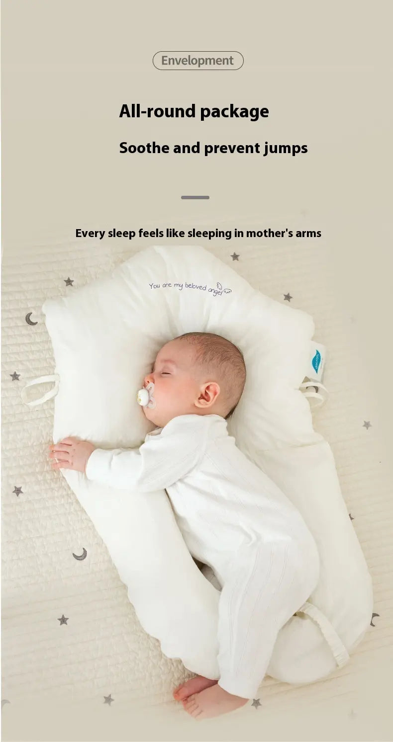 Baby sleeping under a white envelope-shaped pillow with text about providing comfort and preventing jumps.
