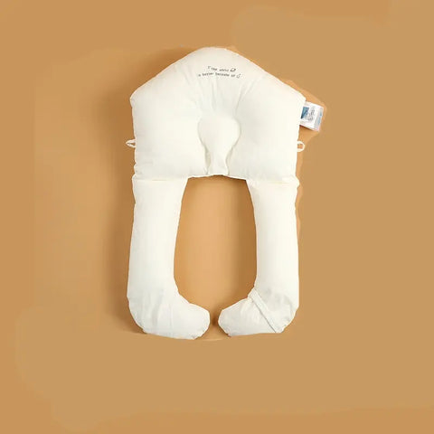 White U-shaped travel pillow on a beige background